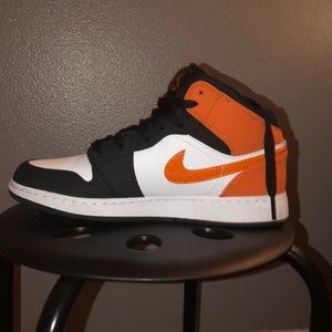 Orange and black Air Jordan 1 Mid